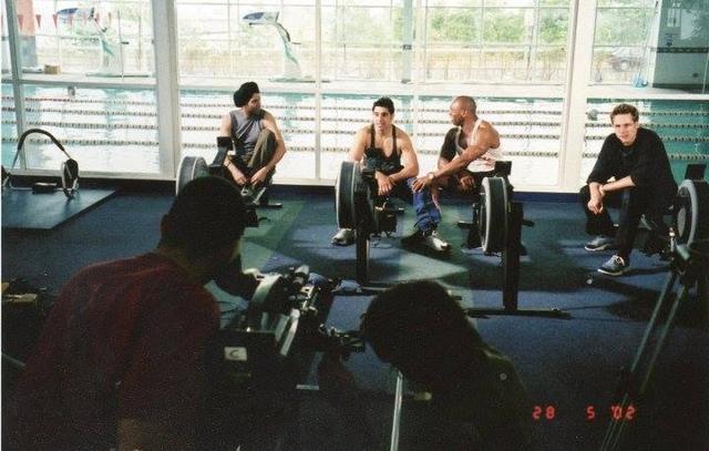 Behind the scenes: the camera crew filming Mak Singh and cast on rowing machines, 2002